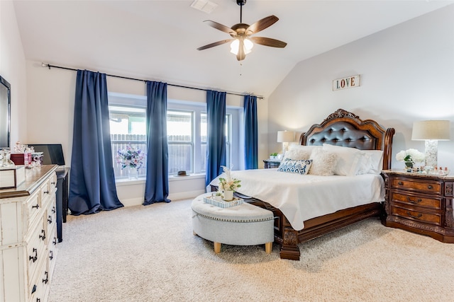 carpeted bedroom with ceiling fan and lofted ceiling