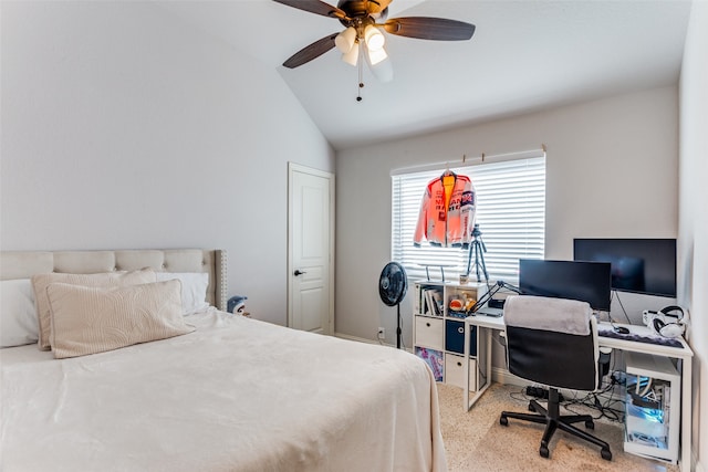 carpeted bedroom featuring ceiling fan and vaulted ceiling