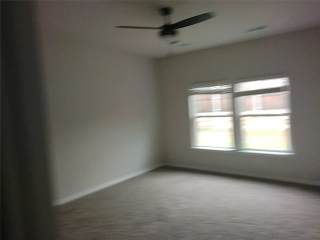 empty room with carpet and ceiling fan