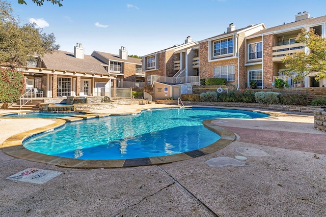 view of swimming pool with a patio area