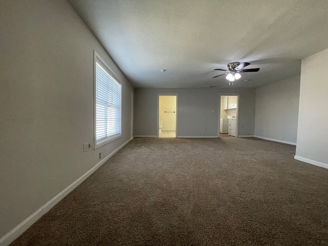 spare room with ceiling fan, carpet floors, a textured ceiling, and separate washer and dryer