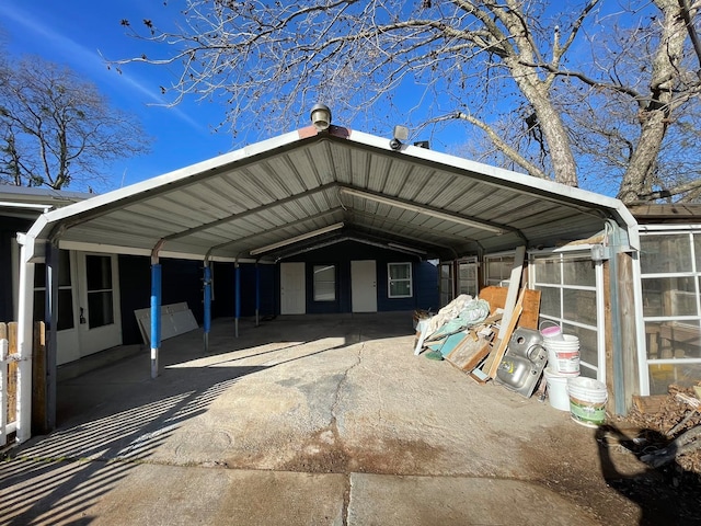 view of vehicle parking with a carport