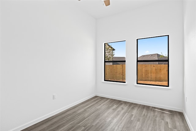 unfurnished room featuring ceiling fan and light wood-type flooring