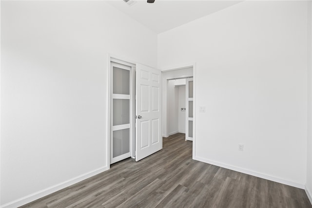 unfurnished bedroom featuring dark wood-type flooring