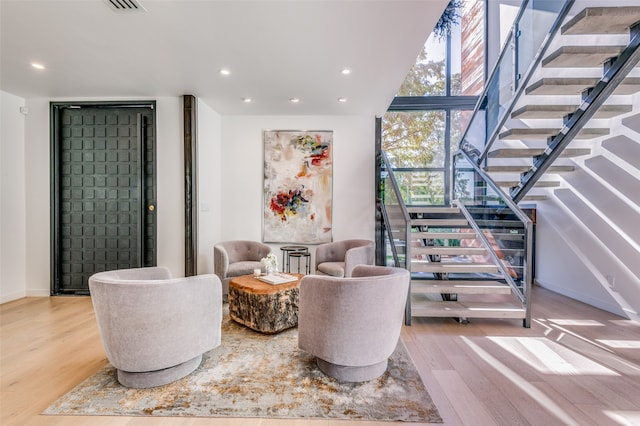 interior space with light hardwood / wood-style floors and floor to ceiling windows