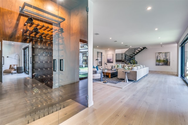 interior space featuring wood-type flooring and a high ceiling