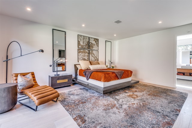 bedroom featuring hardwood / wood-style flooring