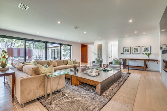 living room with light hardwood / wood-style floors