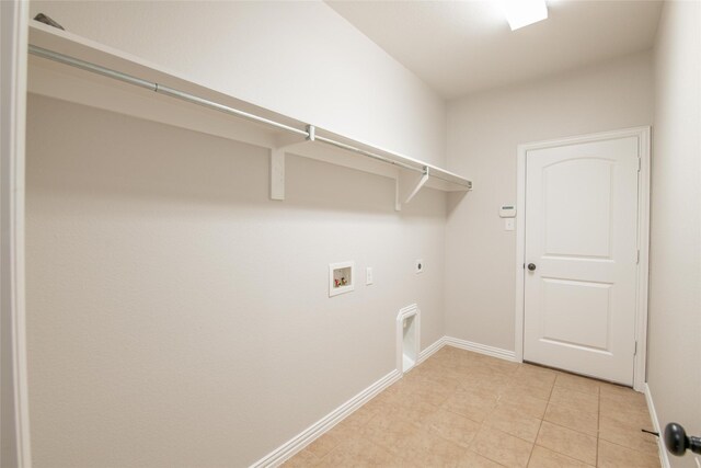 laundry room featuring washer hookup, laundry area, baseboards, and electric dryer hookup