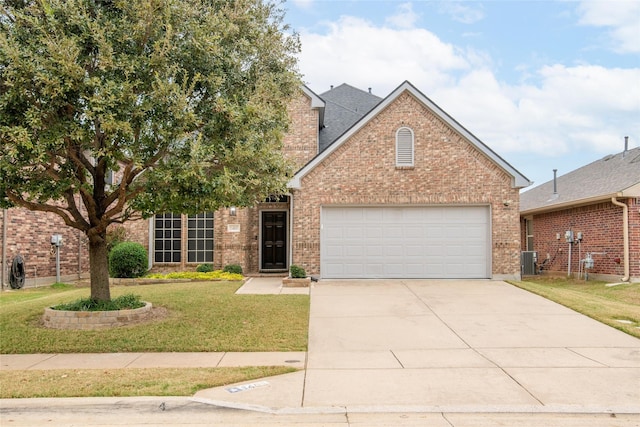 view of front of house featuring driveway, central AC, a front yard, a garage, and brick siding