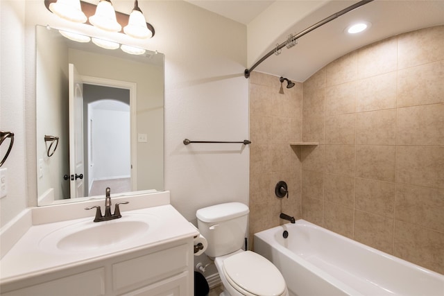 full bathroom featuring vanity, toilet, and tiled shower / bath