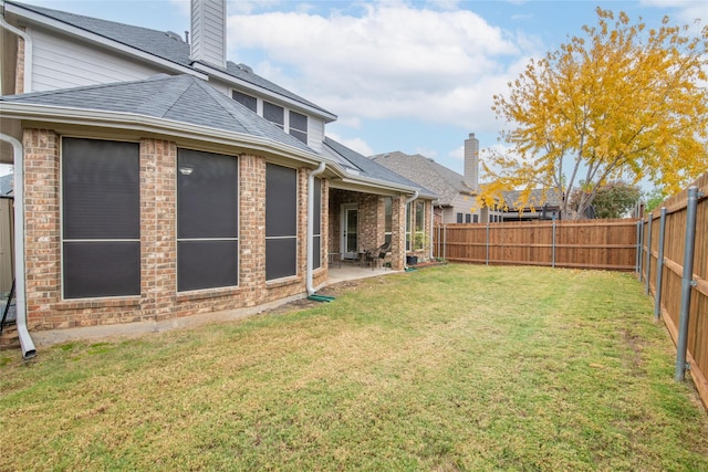 view of yard with a fenced backyard and a patio area