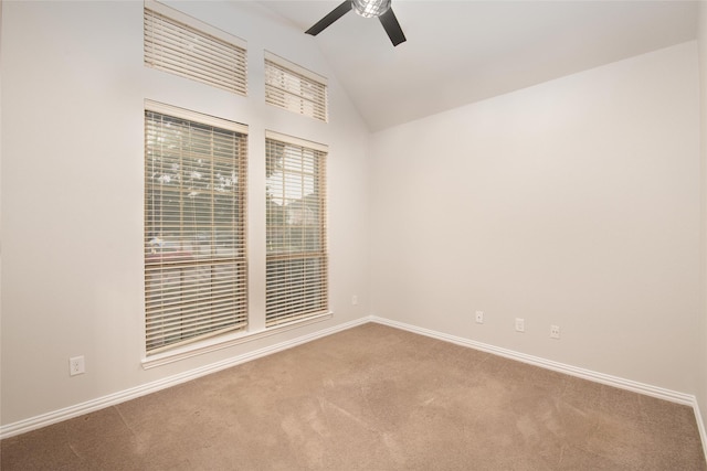 empty room with baseboards, carpet floors, lofted ceiling, and ceiling fan