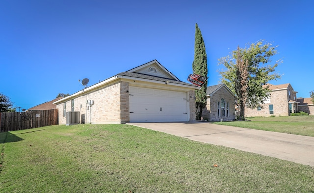 ranch-style house featuring a garage and a front lawn