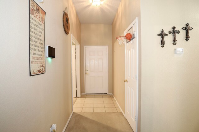 corridor with light tile patterned floors