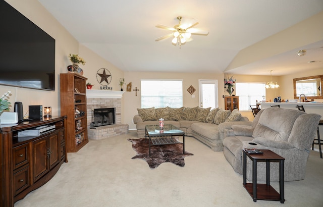 living room with light carpet, plenty of natural light, and lofted ceiling