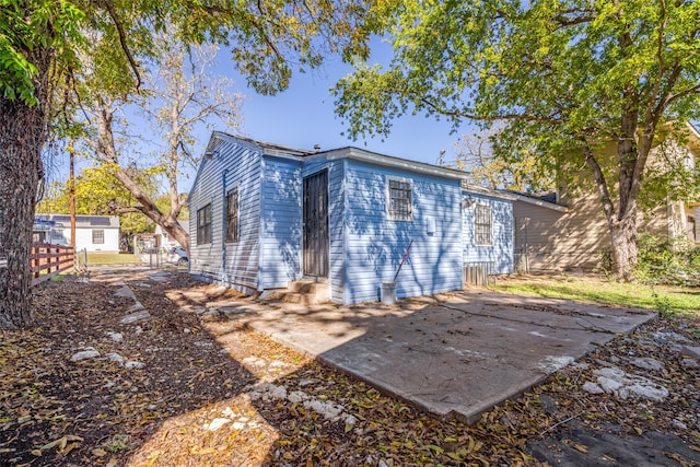 back of property featuring a patio