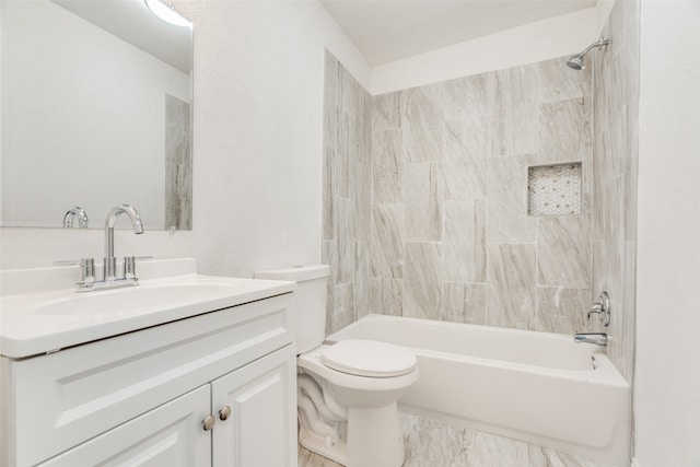 full bathroom featuring toilet, vanity, and tiled shower / bath combo