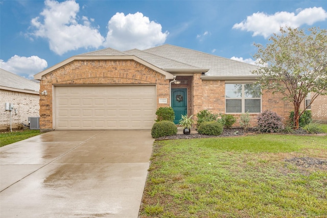 ranch-style house featuring a garage and a front yard