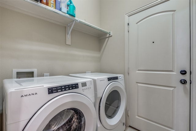 laundry room featuring washer and clothes dryer