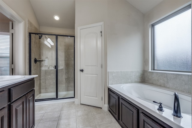 bathroom featuring a wealth of natural light and lofted ceiling