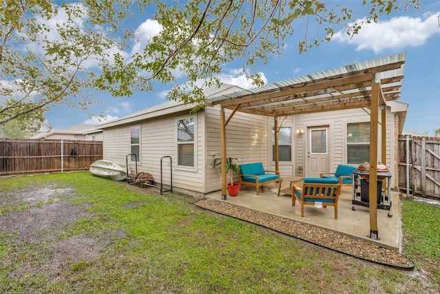 rear view of house featuring a lawn, a patio area, and a pergola