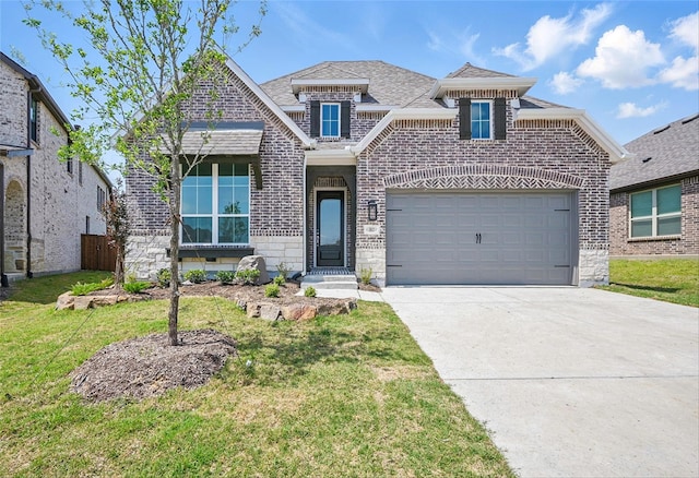 view of front of property featuring stone siding, a front lawn, driveway, and brick siding