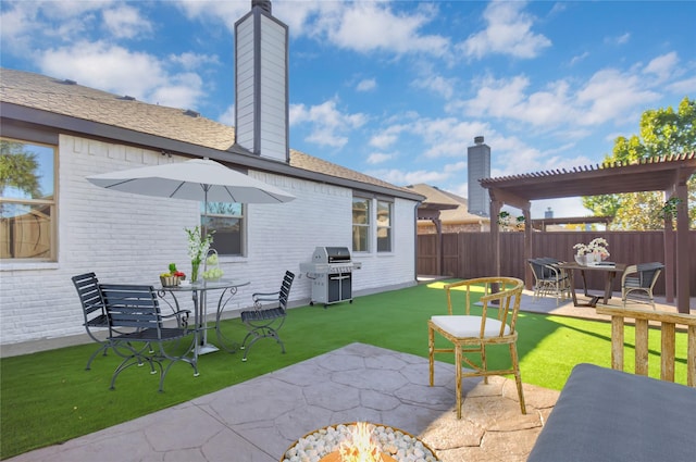 view of patio / terrace featuring a grill and a pergola