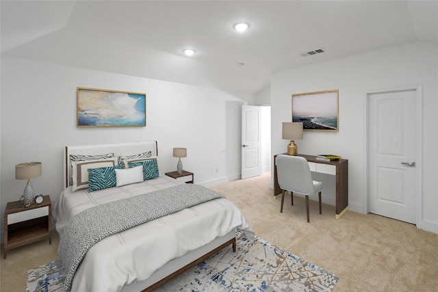 carpeted bedroom with vaulted ceiling