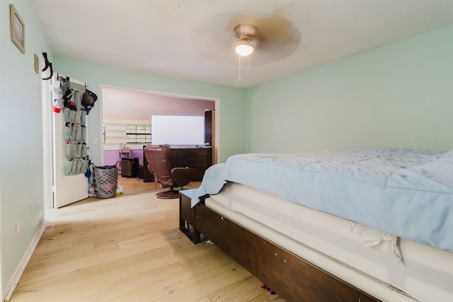 bedroom featuring light wood-type flooring and ceiling fan