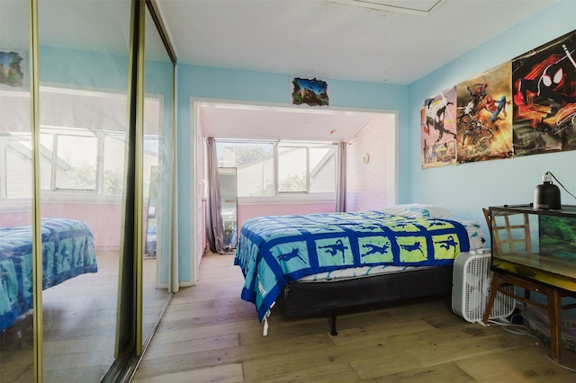 bedroom with light hardwood / wood-style floors