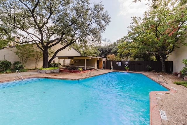 view of pool featuring a patio