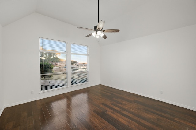 unfurnished room with ceiling fan, dark hardwood / wood-style flooring, and vaulted ceiling