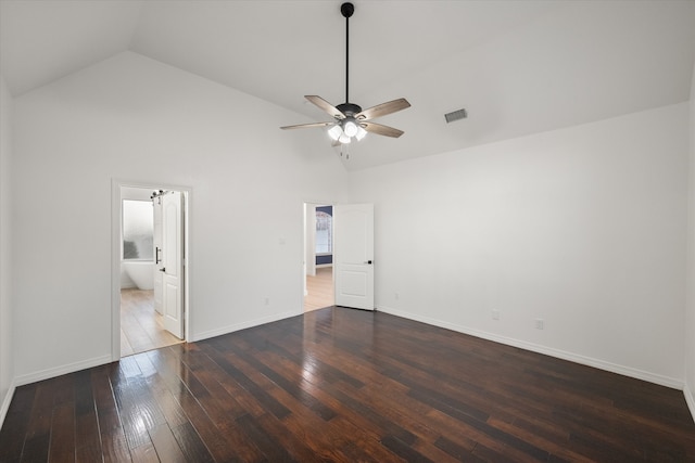 empty room with hardwood / wood-style flooring, high vaulted ceiling, and ceiling fan