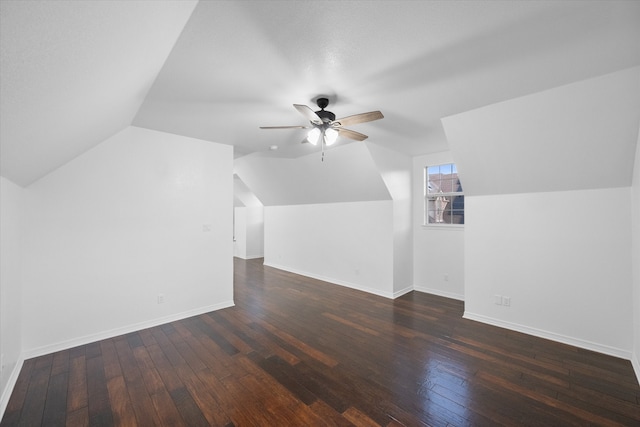 bonus room featuring vaulted ceiling, ceiling fan, and dark hardwood / wood-style floors