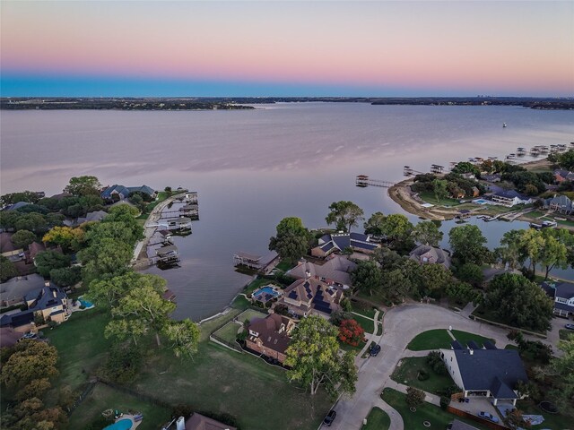 aerial view at dusk with a water view