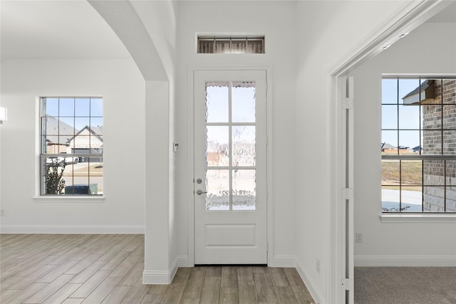 entryway with plenty of natural light and light wood-type flooring