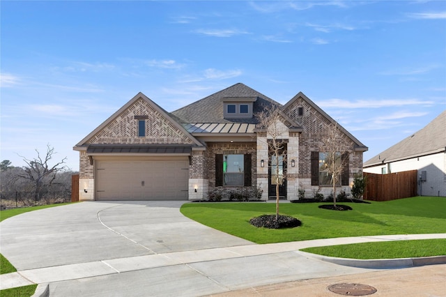 view of front facade featuring a front yard and a garage