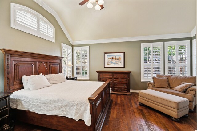 bedroom featuring ceiling fan, dark hardwood / wood-style flooring, ornamental molding, and vaulted ceiling