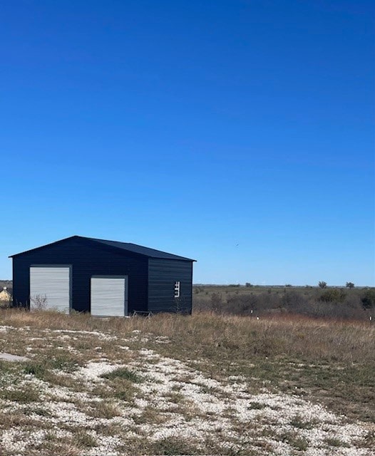 view of outdoor structure with a garage