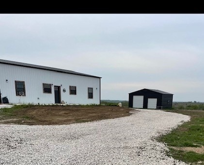 exterior space with an outdoor structure and a garage