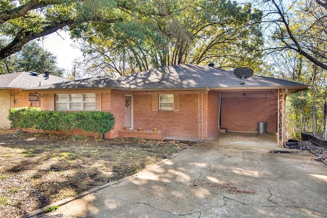 ranch-style home featuring a carport