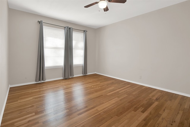 unfurnished room with wood-type flooring and ceiling fan