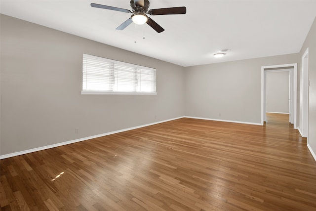 empty room featuring ceiling fan and wood-type flooring