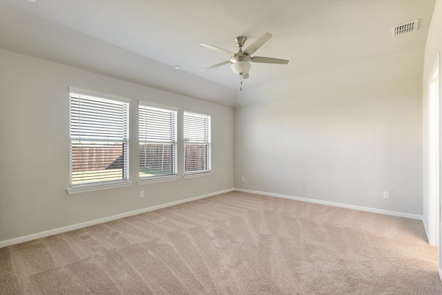 unfurnished room featuring light colored carpet and ceiling fan