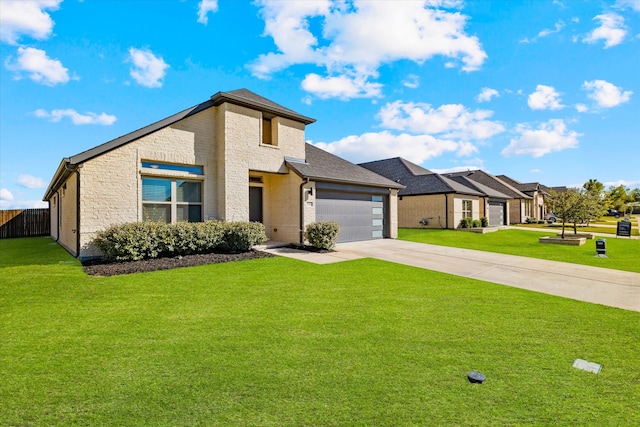 view of front of house featuring a front lawn and a garage