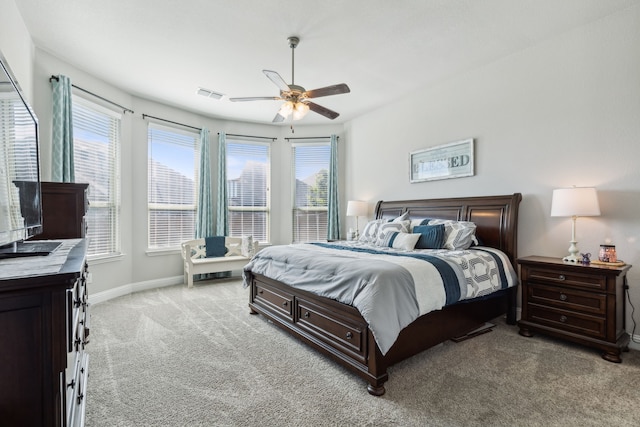 bedroom with ceiling fan and light colored carpet