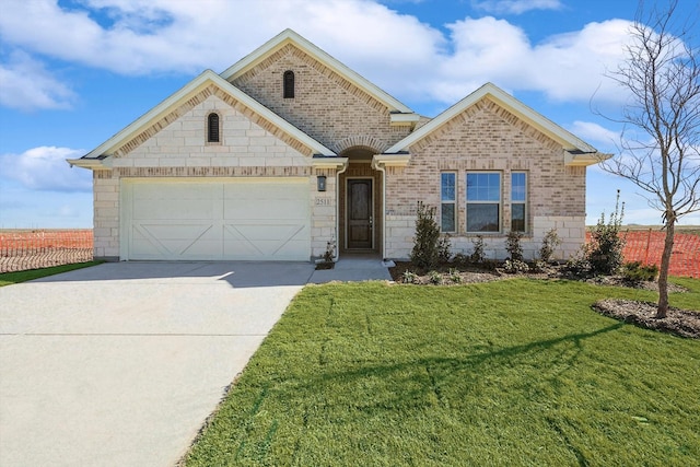 view of front of property with brick siding, a front yard, fence, a garage, and driveway