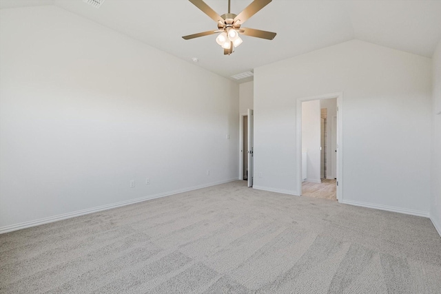 unfurnished bedroom with lofted ceiling, light colored carpet, visible vents, ceiling fan, and baseboards