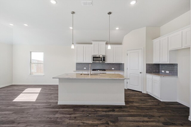 kitchen with white cabinetry, a kitchen island with sink, and stainless steel appliances